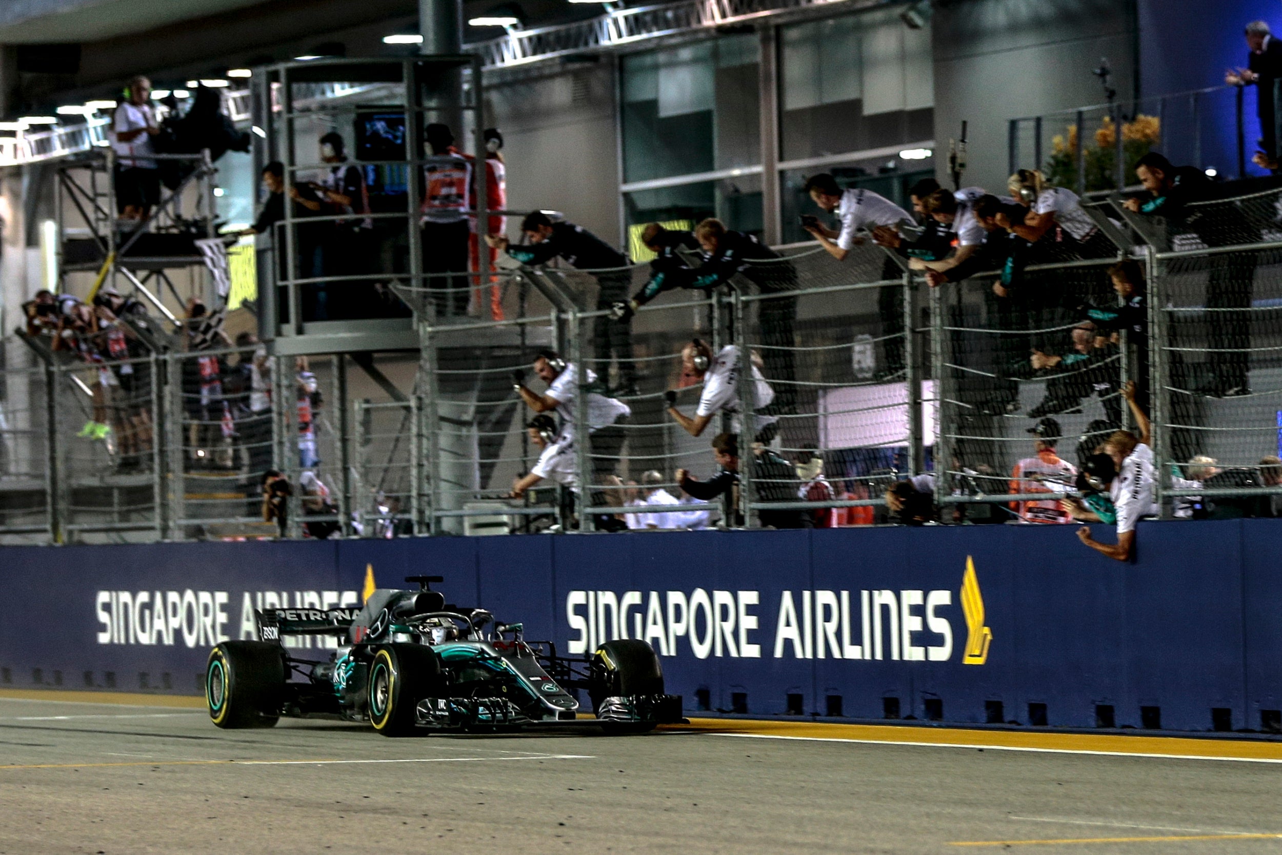 Hamilton crosses the line to take victory in Singapore