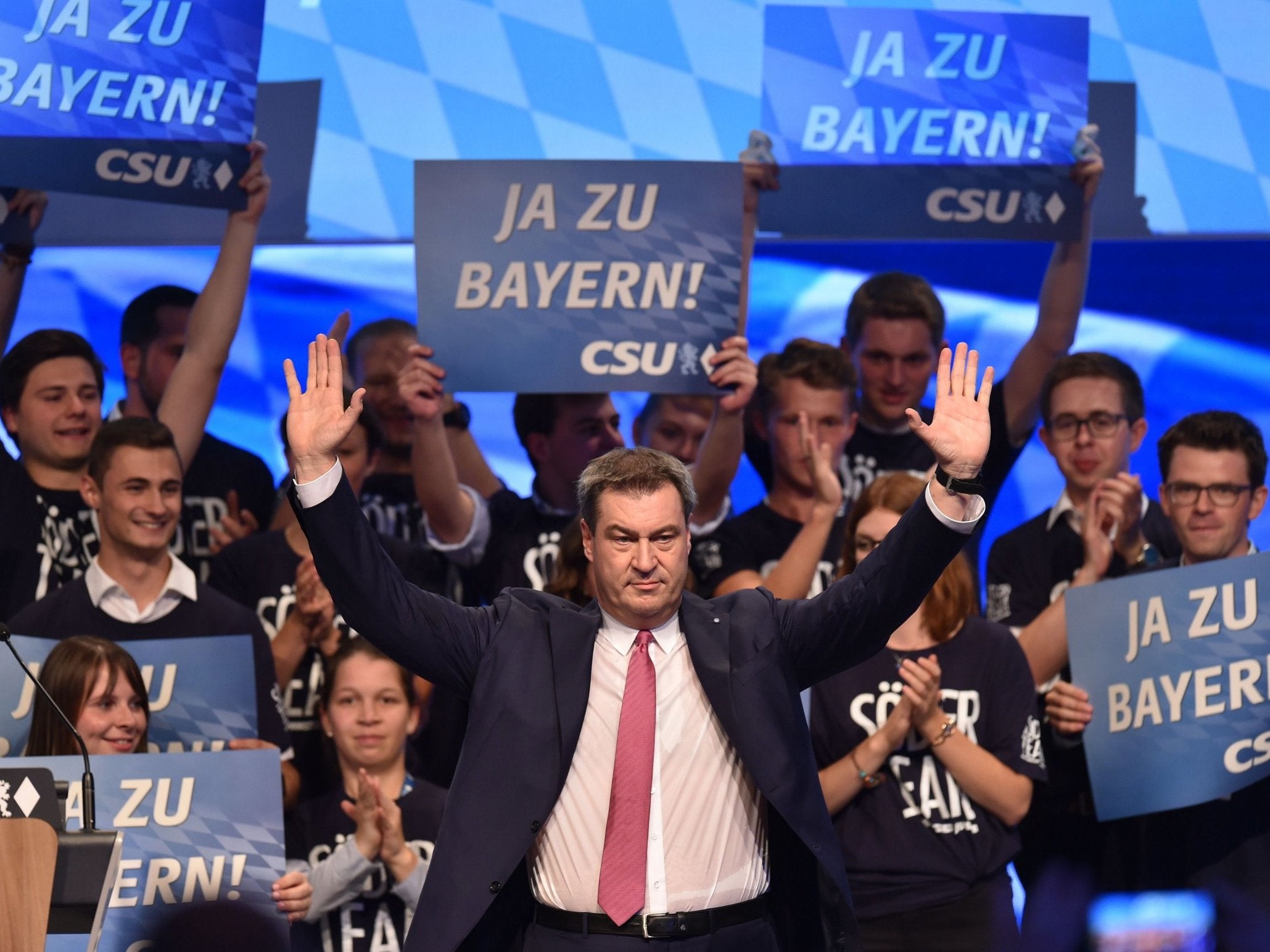 Bavaria's governor, Markus Soeder, waves after his speech at the Christian Social Union party congress in Munich