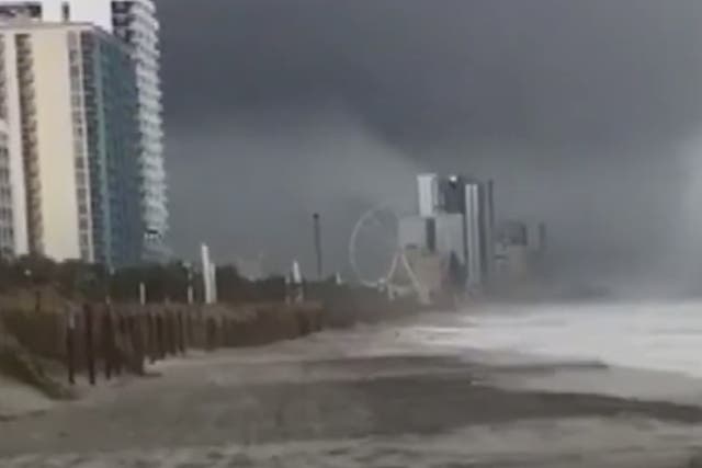 A waterspout turns into a tornado as it makes landfall in Myrtle Beach, South Carolina, just days after tropical storm Florence.