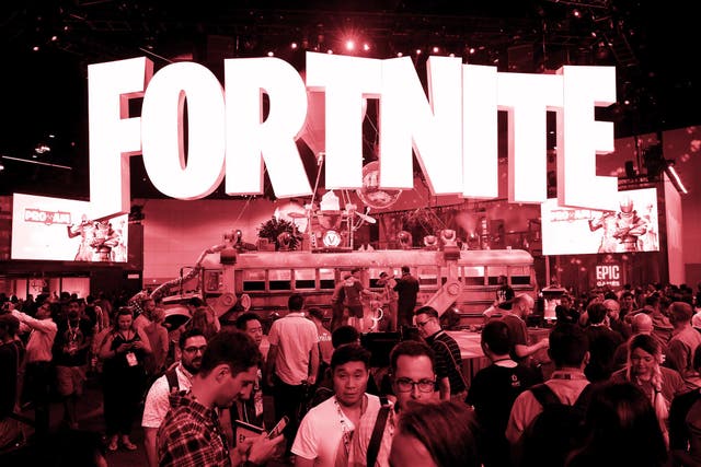 Game enthusiasts and industry personnel visit the 'Fortnite' exhibit during the Electronic Entertainment Expo E3 at the Los Angeles Convention Center