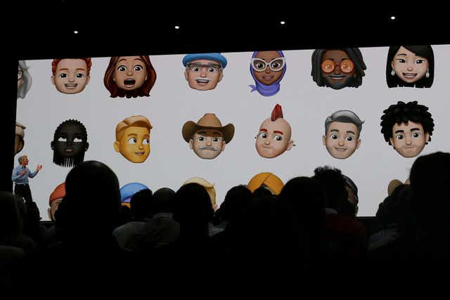 Apple senior vice president of Software Engineering Craig Federighi displays a sampling of new Memoji avatars at the Apple Worldwide Developer Conference