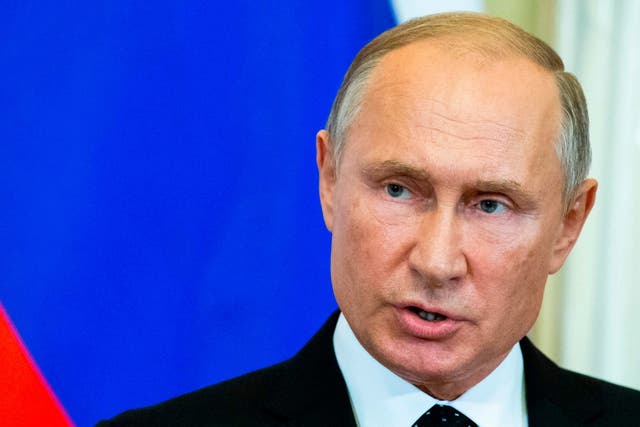 Russian President Vladimir Putin speaks to the media on September 18