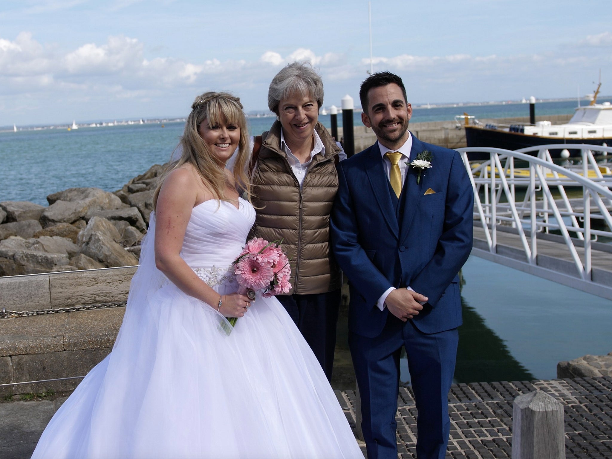 Theresa May poses with Michelle and Jason Dight