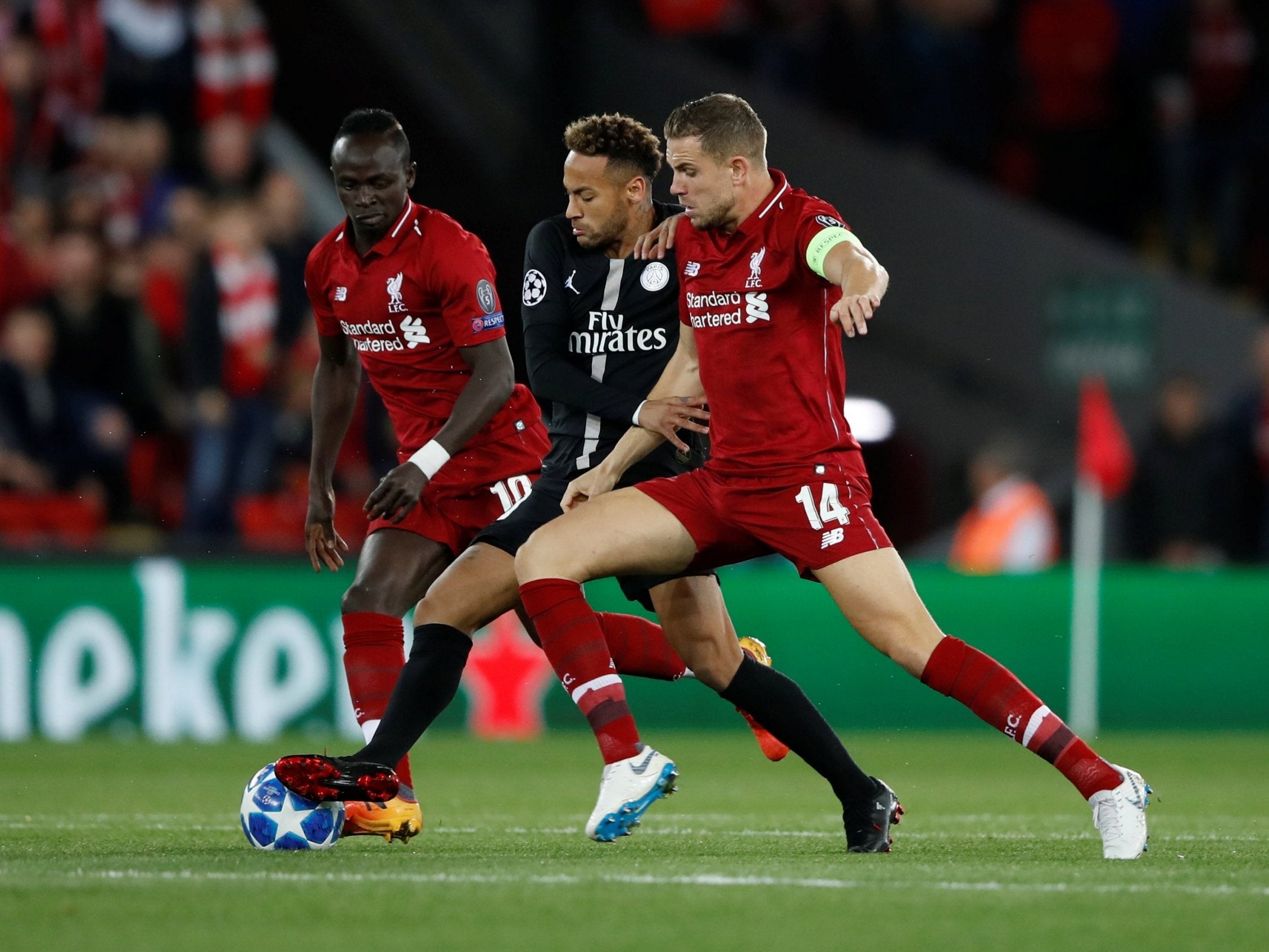 Neymar is challenged by Jordan Henderson