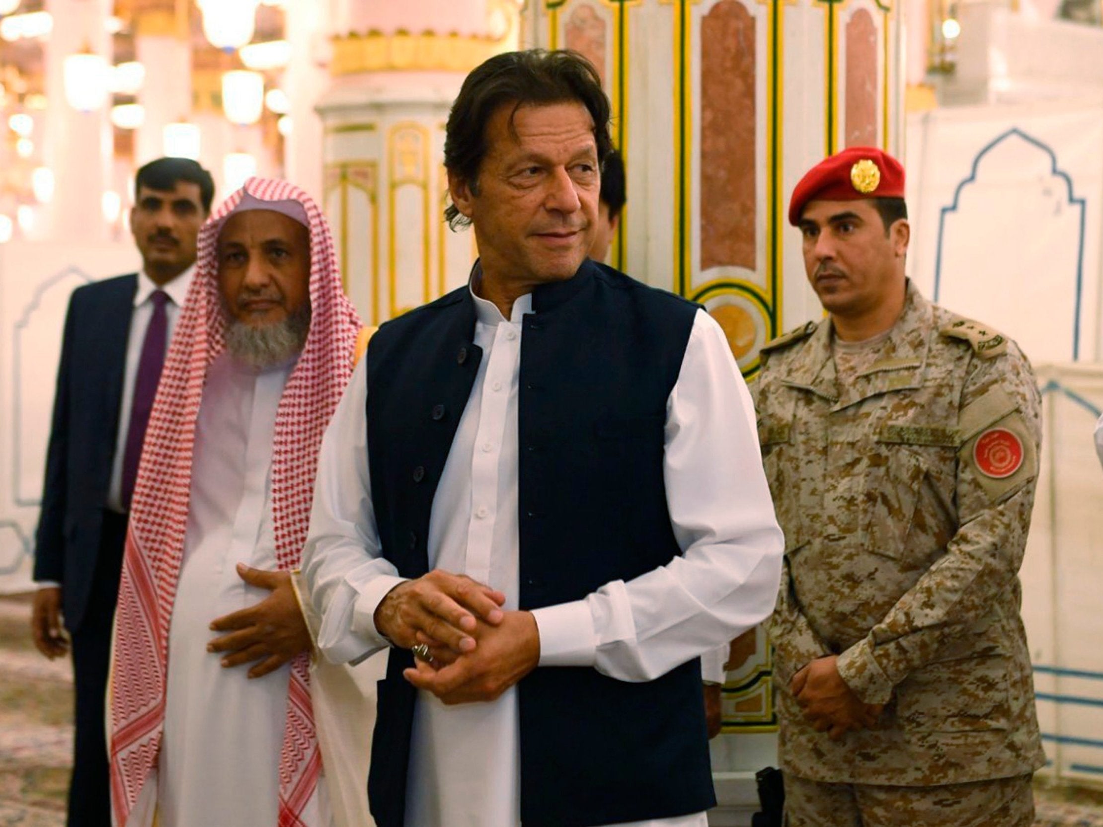 Imran Khan visits the Prophet's Mosque in Medina, Saudi Arabia, during his first overseas trip since taking office