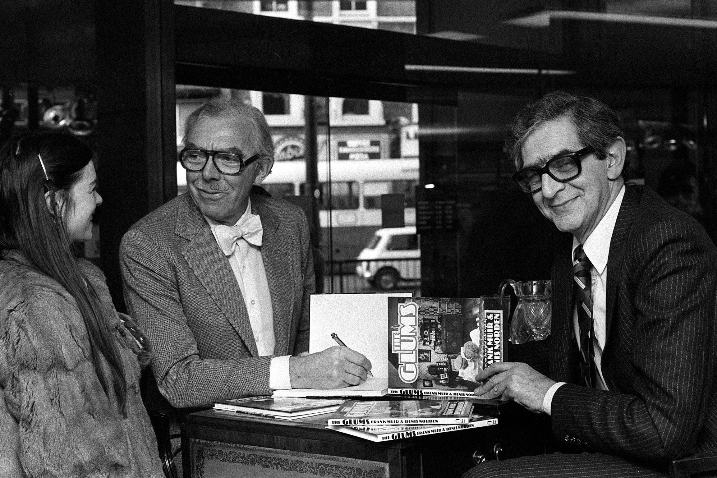 &#13;
Frank Muir and Denis Norden (right) at a store in London's Kensignton High Street, signing copies of their book "The Glums" from the TV series (PA Archive/PA Images)&#13;