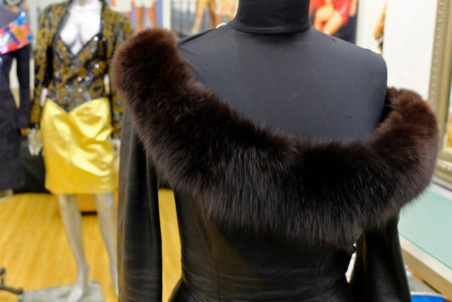 A vintage fox trimmed leather dress displayed in the basement of a store in San Francisco