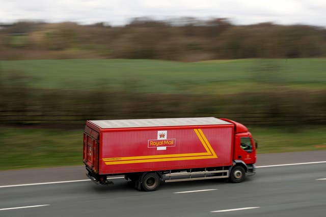 A Royal Mail truck on the move. But the company's earnings and share price are going backwards