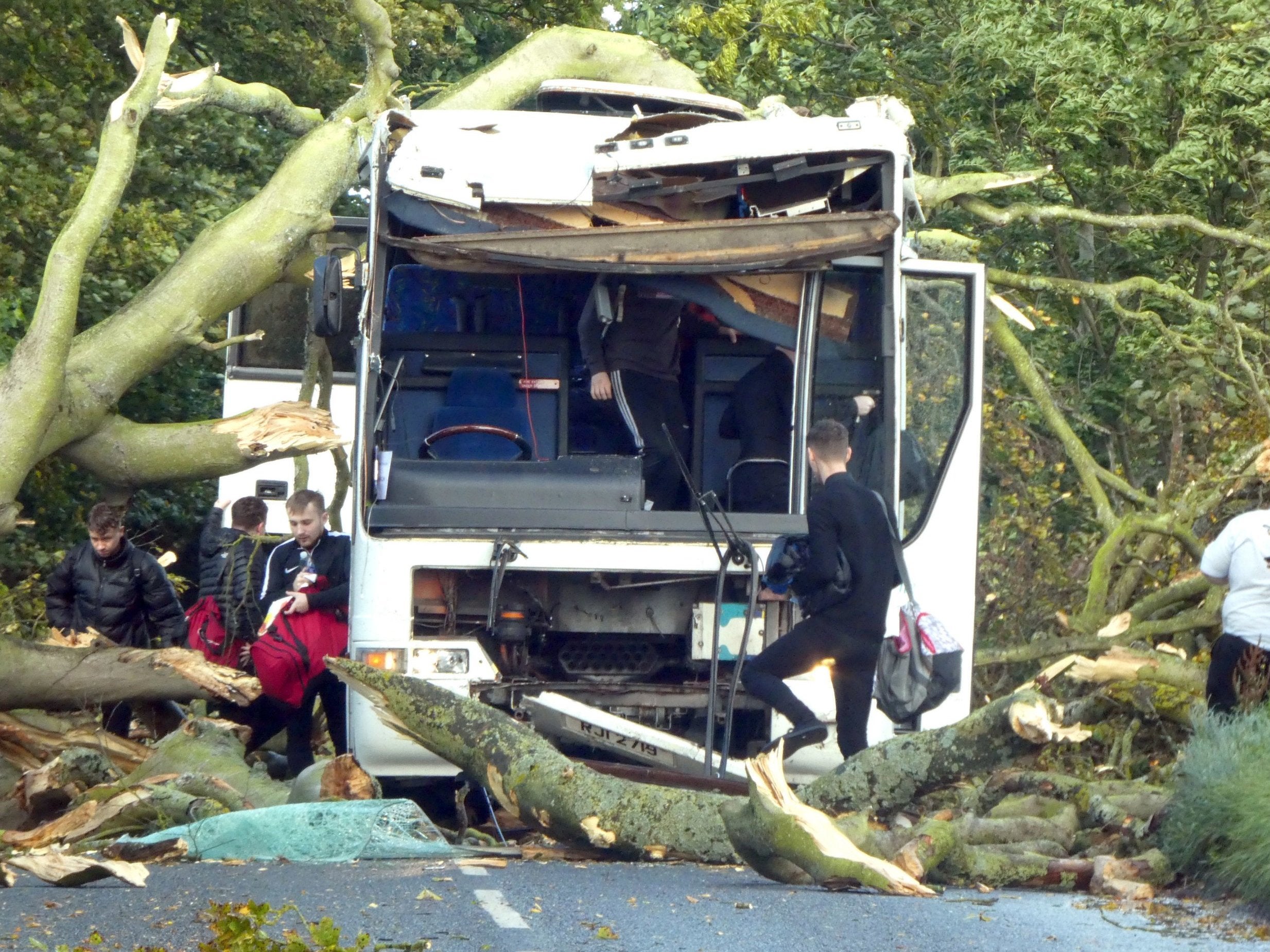 A bus carrying Dundee University was badly damaged by a falling tree