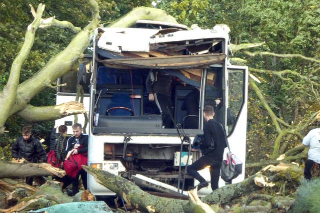 A bus carrying Dundee University was badly damaged by a falling tree