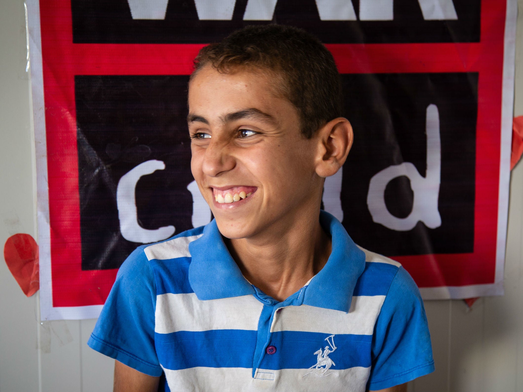 Ahmed, 13, who fled Mosul with his 10 brothers and sisters, says he wants to put together a video of his life in Gamawa camp for the Betty Layward school children