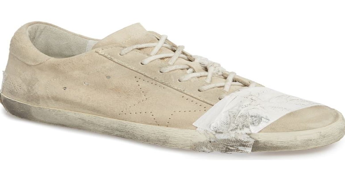 Taped designer trainers heavily condemned for mocking poverty The Independent The Independent