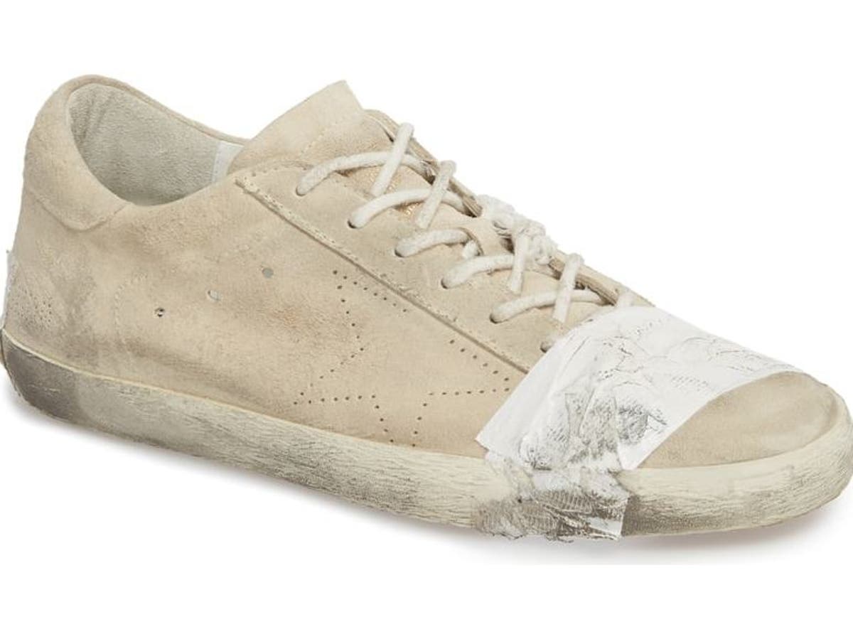 Taped designer trainers heavily condemned for ‘mocking poverty’ | The ...