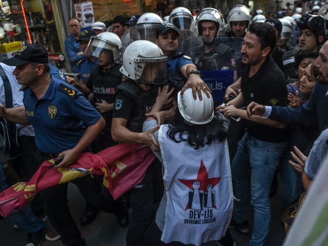 Turkish police officers clash with protesters, gathered in support of workers that were arrested for protesting  labour conditions at Istanbul's new airport