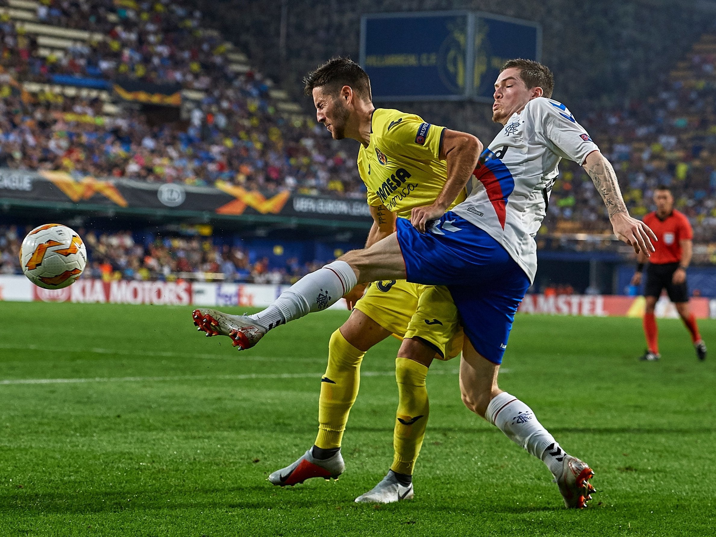 Miguel Llambrich and Ryan Kent tussle for possession