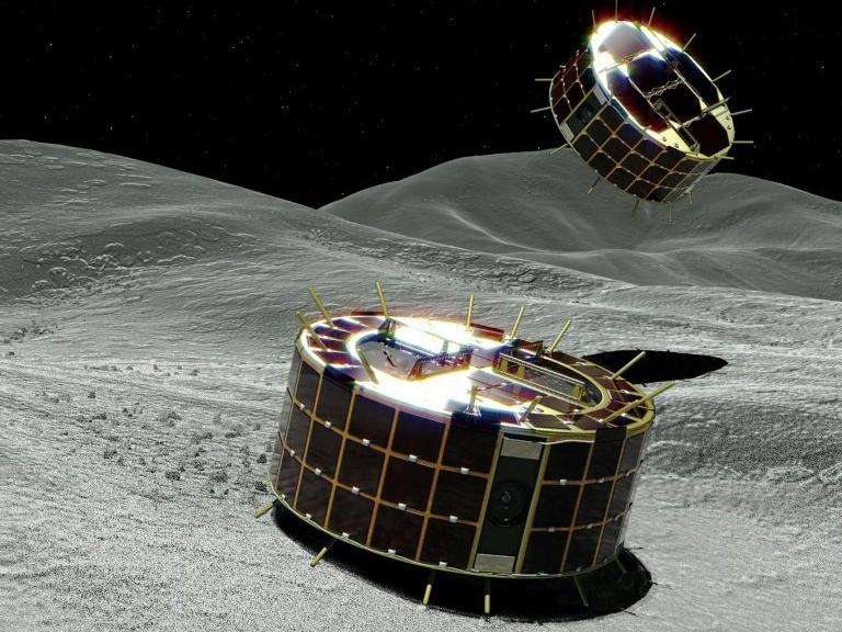 Artists impression of the Minerva-II-1 rovers landing on the surface of the Ryugu asteroid