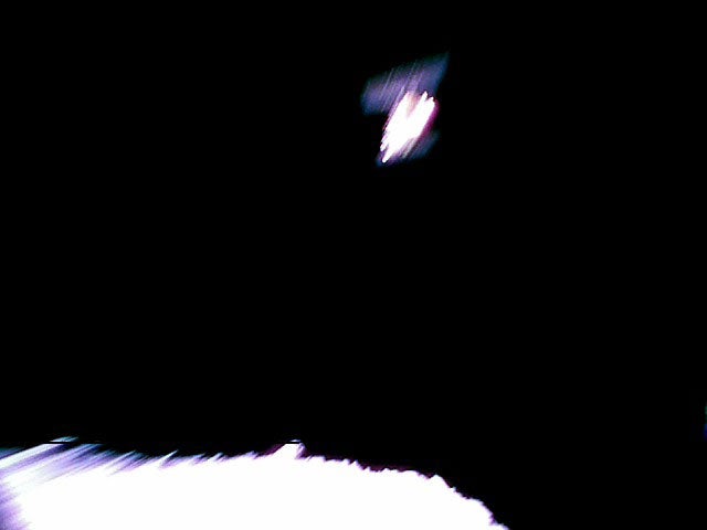 This is an image taken immediately after separation from the spacecraft. Hayabusa-2 is at the top and the surface of Ryugu is bottom. The image is blurred because the shot was taken while the rover was rotating.