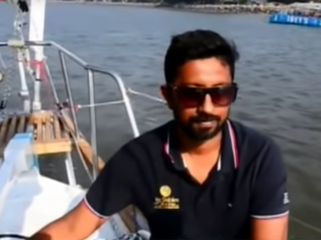 The Indian Navy commander is in his bunk aboard his yacht after sustaining 'severe back injuries' during a storm which snapped the boat's mast