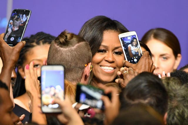 Former first lady Michelle Obama greets supporters after speaking at a rally for When We All Vote's National Week of Action at Chaparral High School on September 23, 2018 in Las Vegas, Nevada.