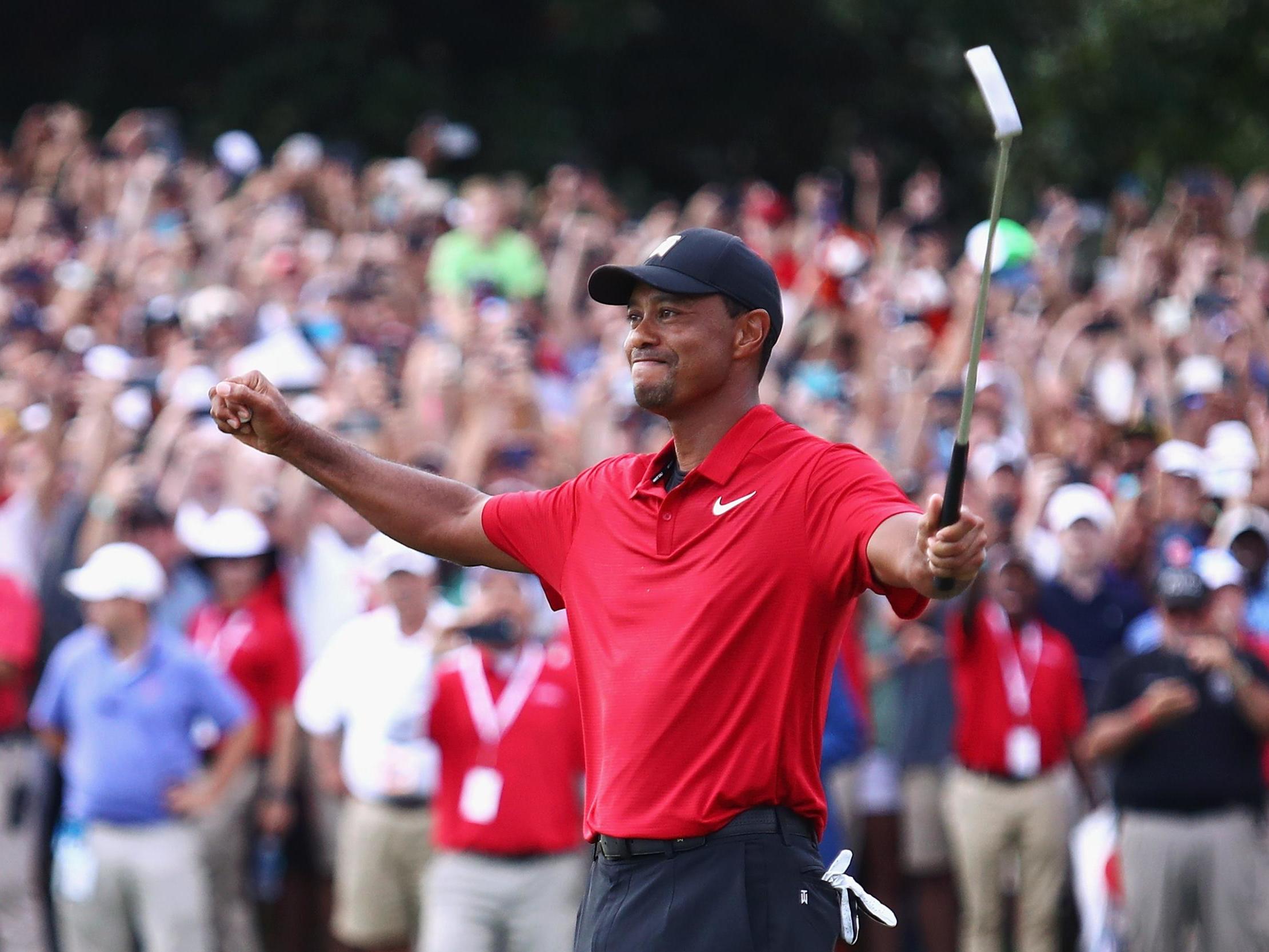 Tiger Woods celebrates after winning the Tour Championship