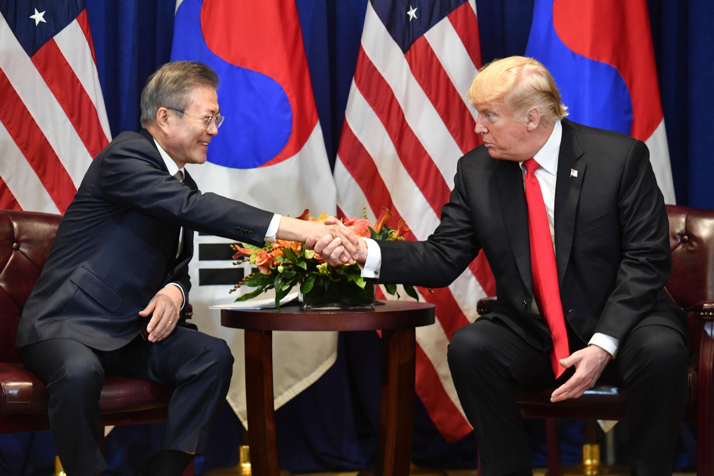 US President Donald Trump shakes hands with South Korean President Moon Jae-in during a bilateral meeting in New York on 24 September 2018