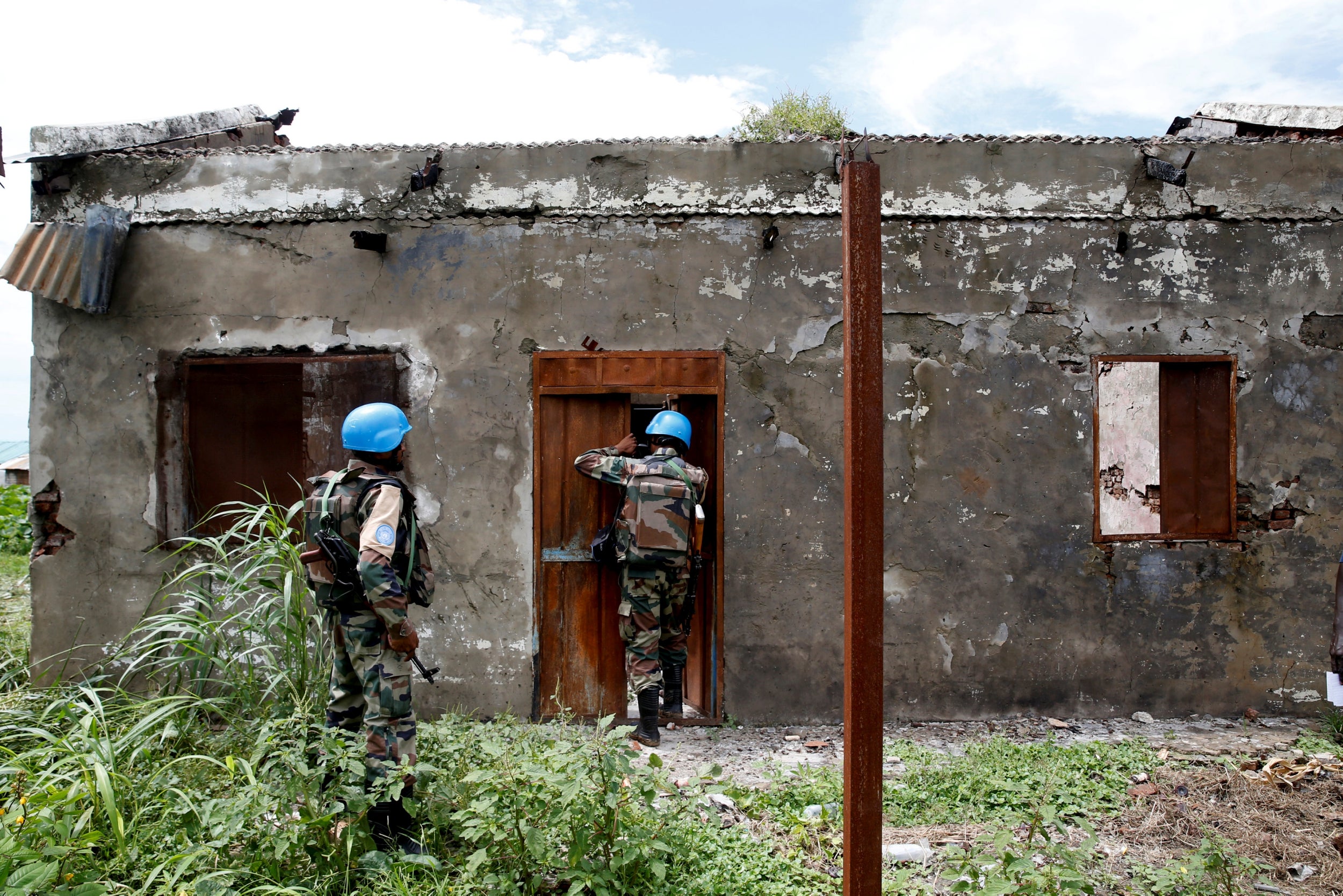 File photo: Indian army peacekeepers with UNMISS (UN Mission in South Sudan) look inside a health clinic destroyed by fighting in the village of Wau Shilluk on the white Nile near the town of Malakal, in the Upper Nile state of South Sudan in 8 September 2018