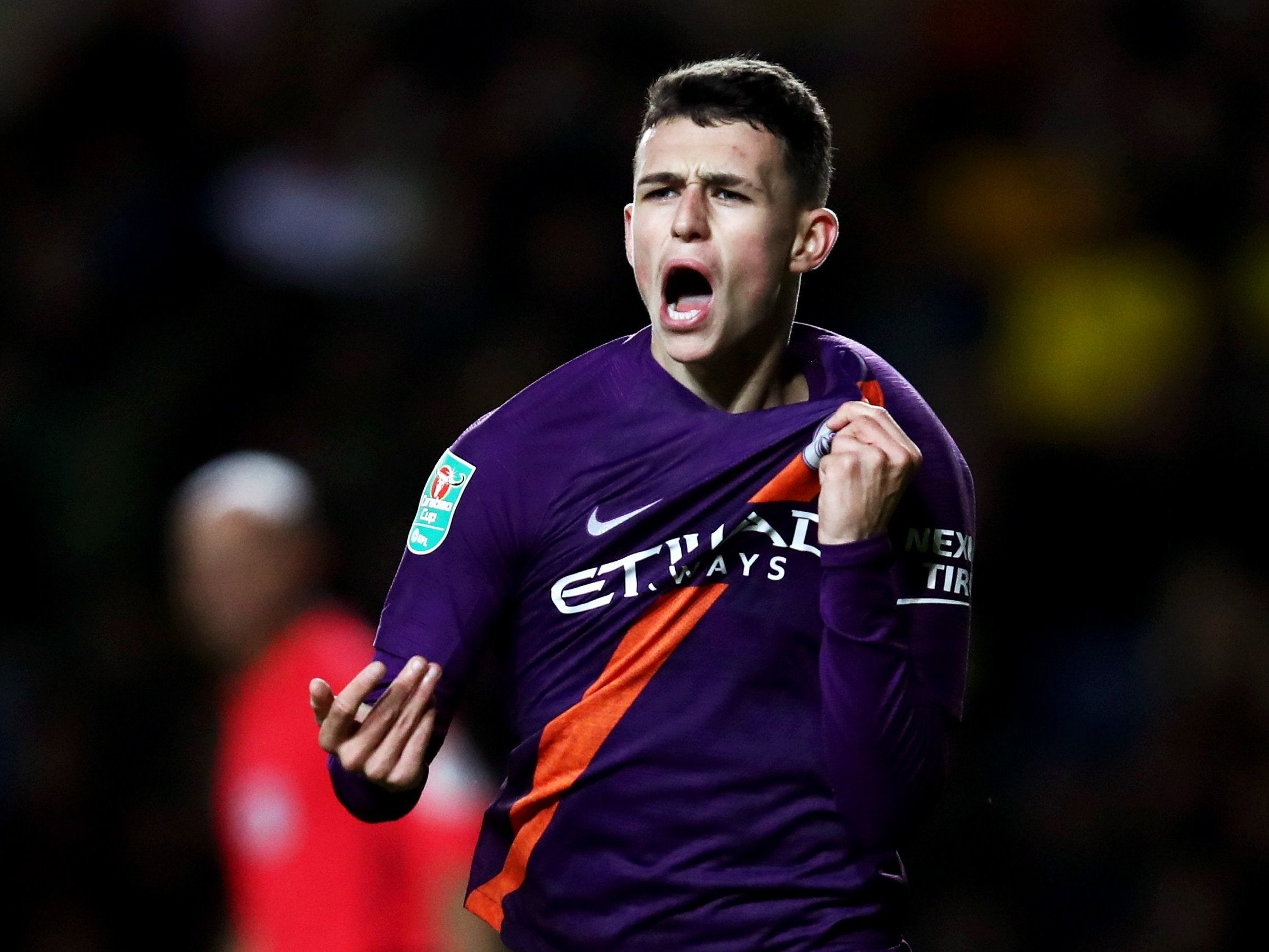 Phil Foden celebrates his late goal at the Kassam Stadium