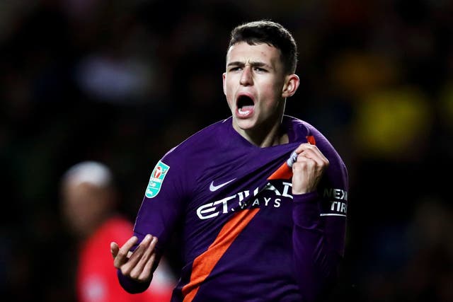 Phil Foden celebrates his late goal at the Kassam Stadium