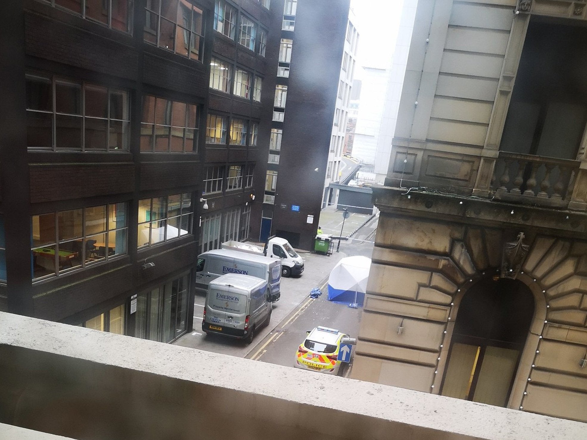 Police are investigating the death of a man in Portland Street, Manchester city centre