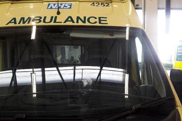 An ambulance with a broken windscreen after a brick attack in Birmingham
