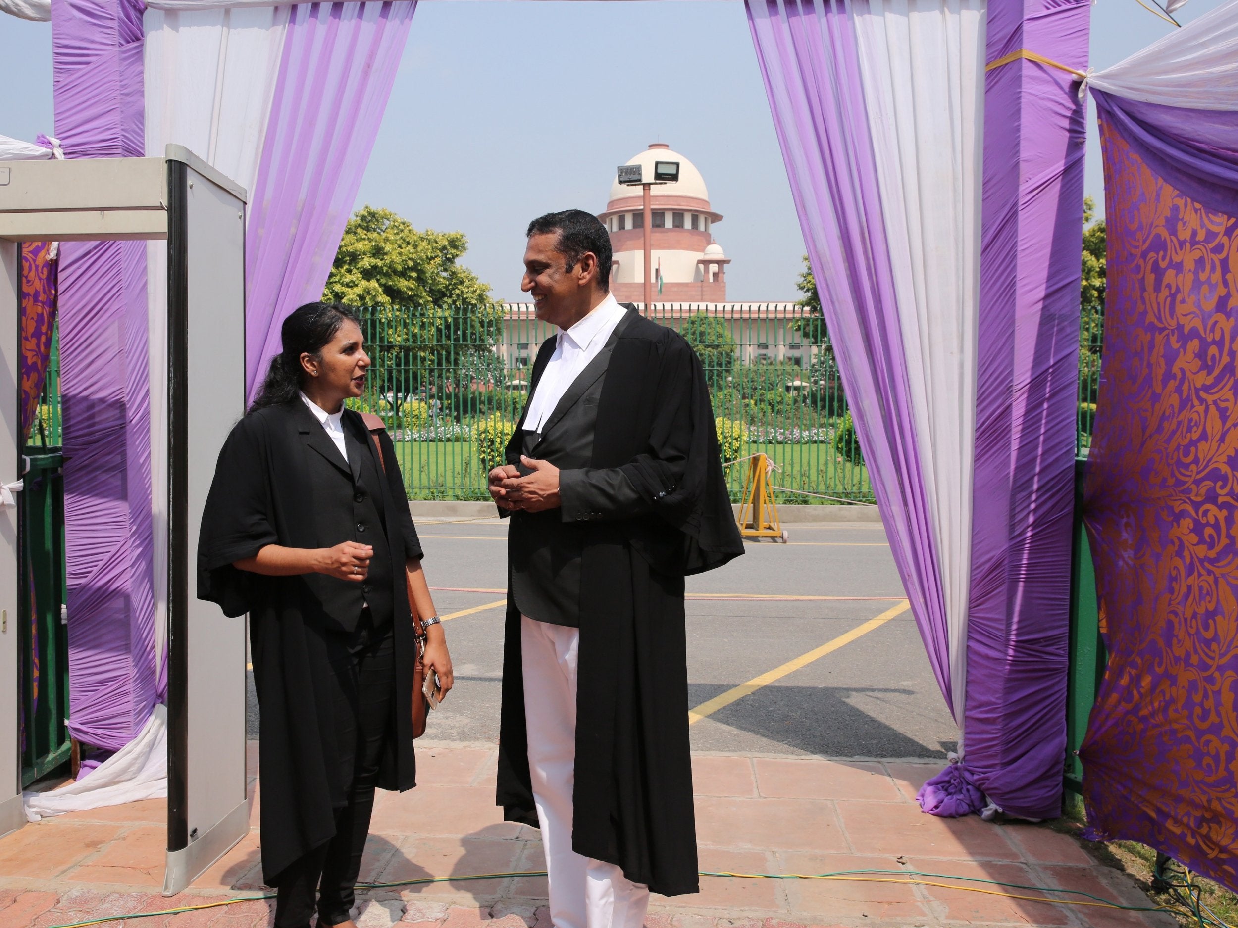 Lawyers for the successful petitioner stand outside the Supreme Court after the verdict in the adultery case in Delhi