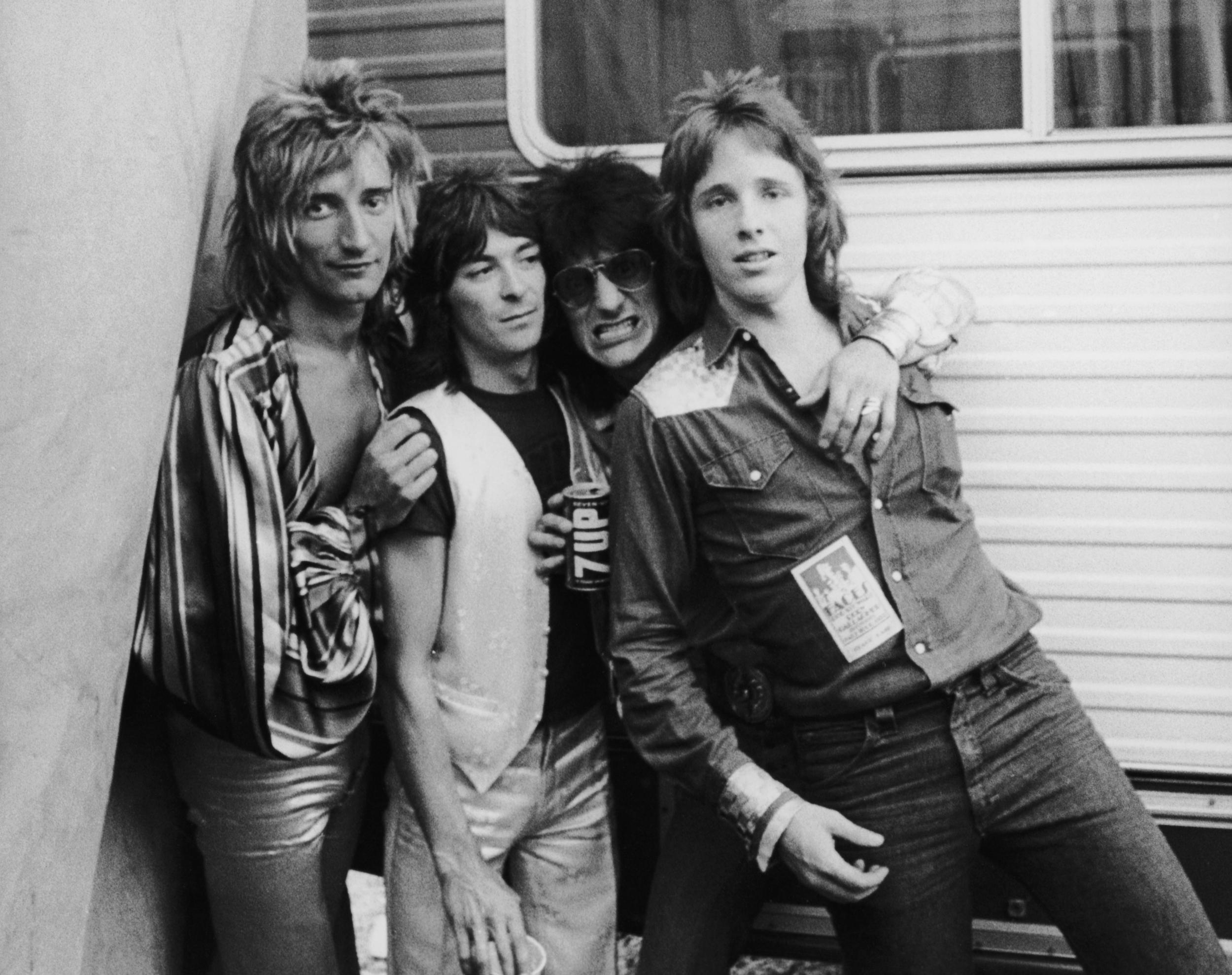 Never a dull moment: Rod with Ian McLagan and Ron Wood of The Faces, and photographer Richard Upper, in 1973 (Getty)