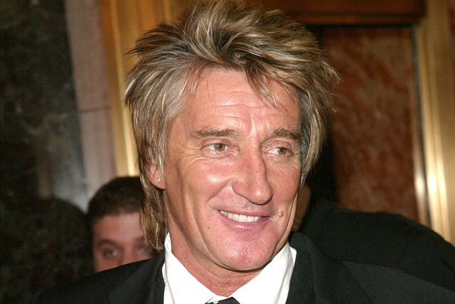Musician Rod Stewart and his girlfriend Penny Lancaster arrive at "The Boy From Oz" musical opening night performance starring actor Hugh Jackman at the Imperial Theatre October 16, 2003 in New York City.