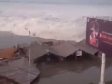 Video shows tsunami crashing into buildings on Indonesian coast