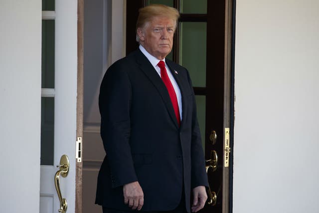 President Donald Trump waits for the arrival of Chilean President Sebastian Pinera at the White House