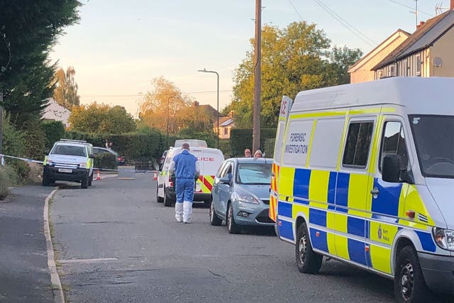 Forensics officers conduct investigations on Saturday after two women died in the Kent village of Hadlow