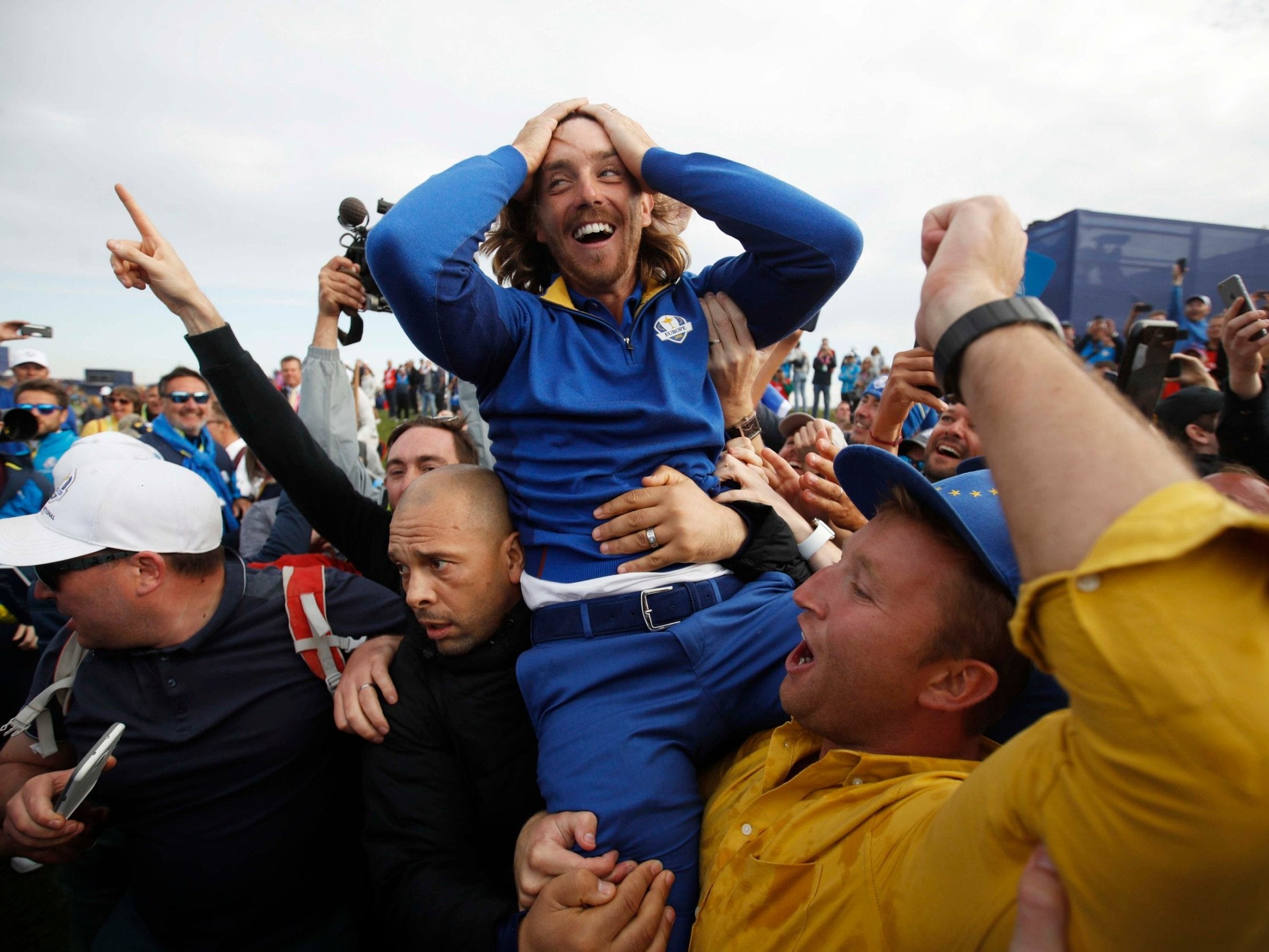 Tommy Fleetwood is held aloft after Europe clinched the Ryder Cup