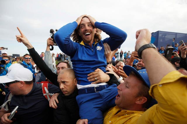 Tommy Fleetwood is held aloft after Europe clinched the Ryder Cup
