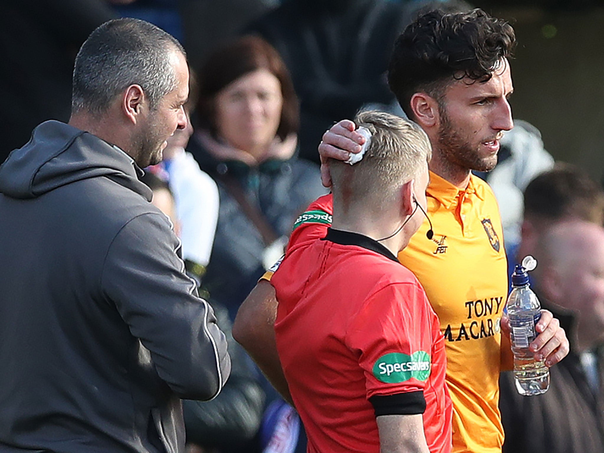 Assistant referee Calum Spence was left with a cut to the back of his head (Getty )