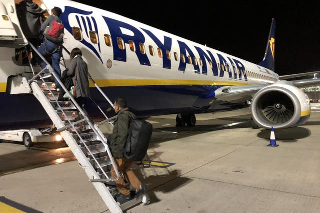Dwindling demand? Passengers boarding a late-evening Ryanair flight from Stansted, the airline's main base
