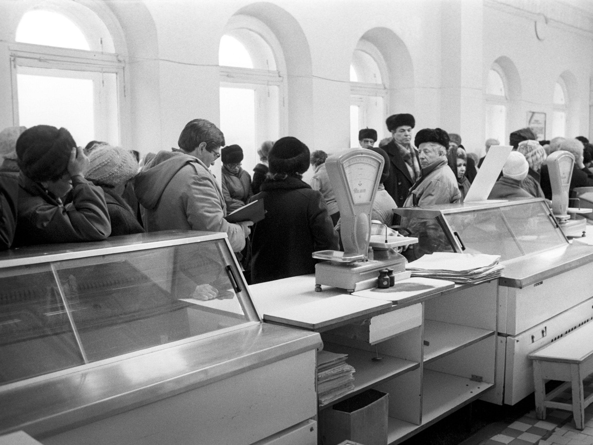 Long queues and near-empty shelves: a Russian shop in 1991, shortly before the end of the Soviet Union