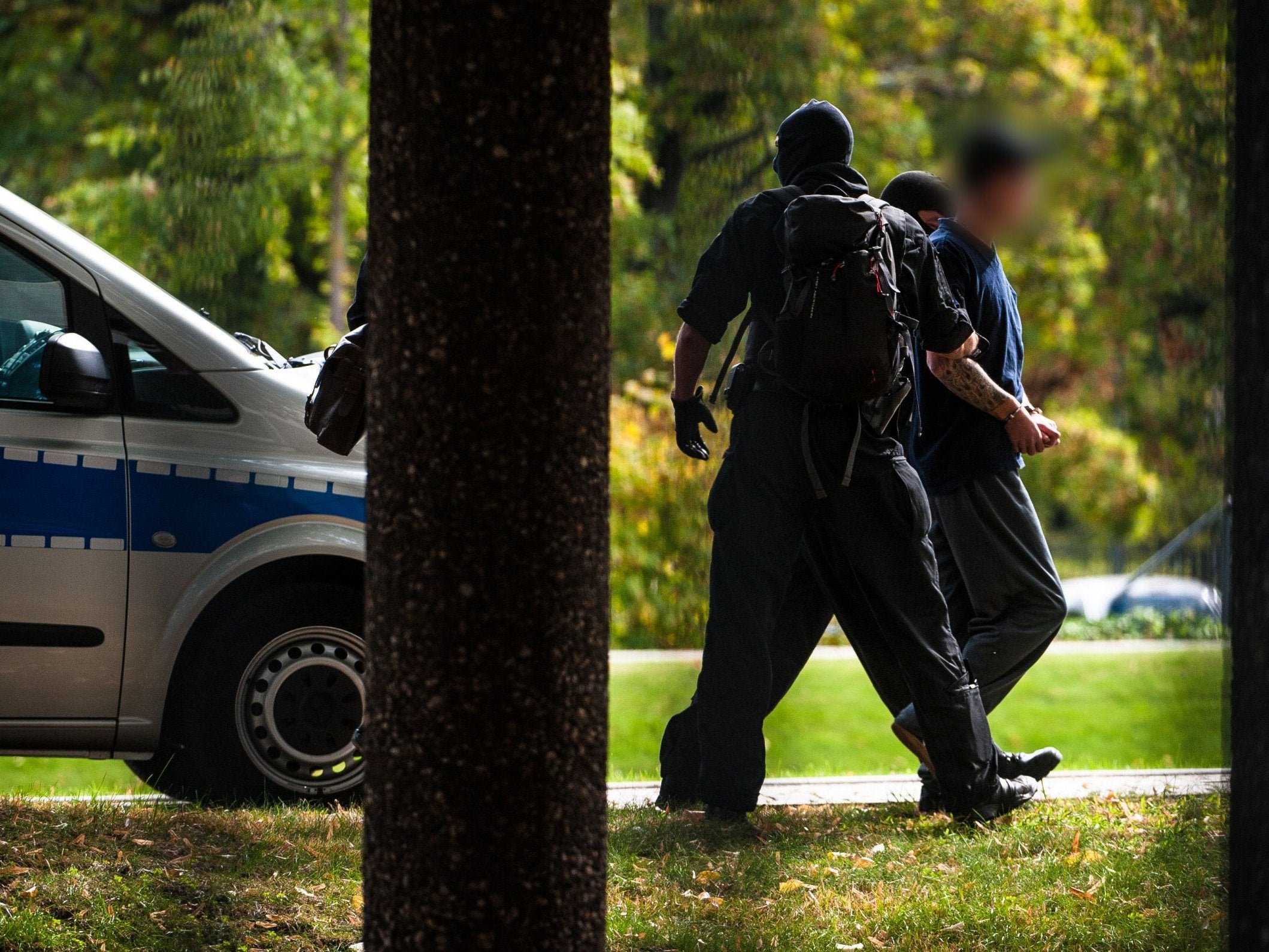 Police escort suspected right-wing terrorist after arriving at Federal Supreme Court in Karlsruhe