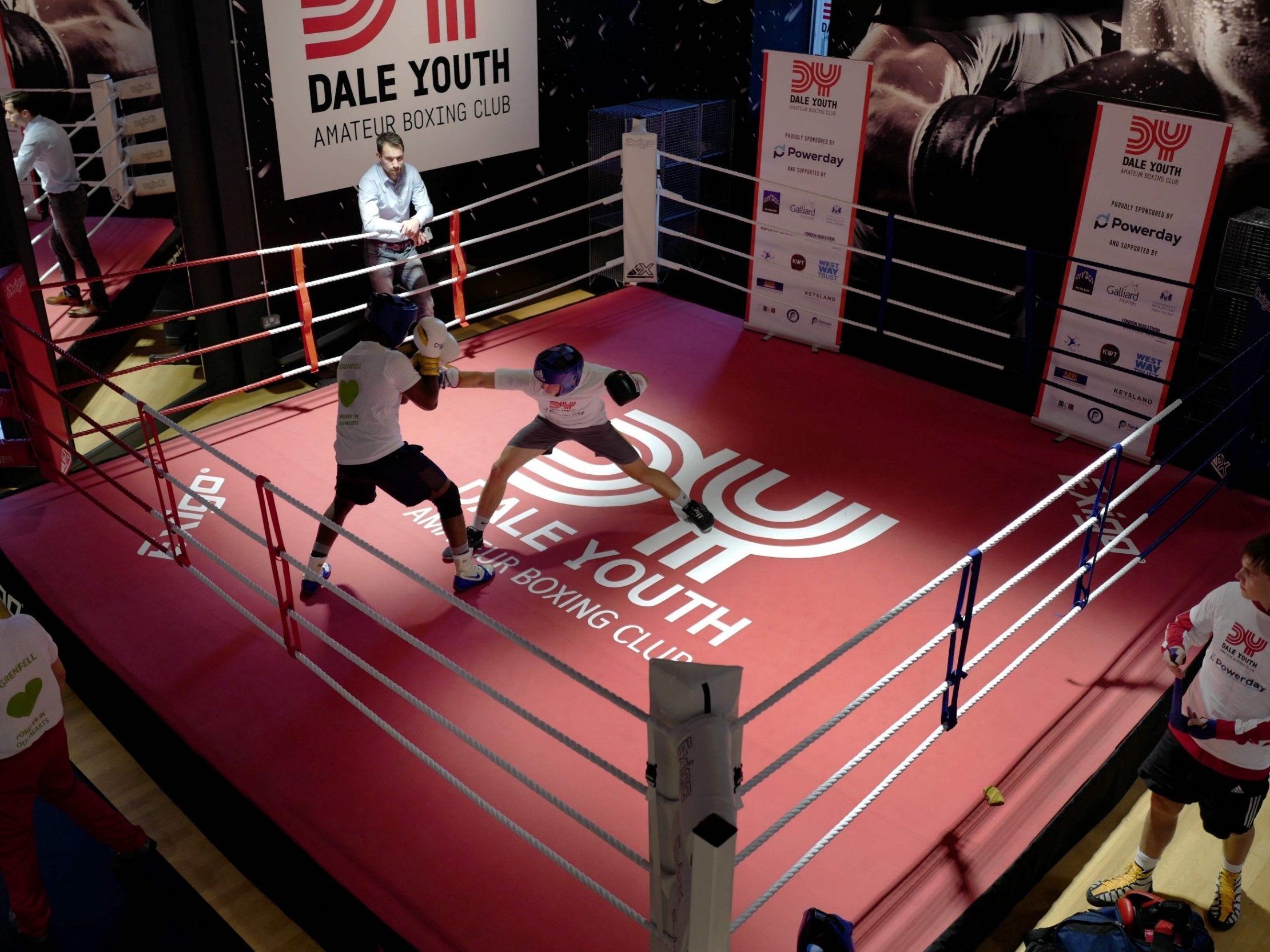 Young boxers spar in the ring