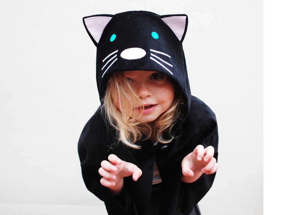 This cute cat cape has a hood for chillier temperatures