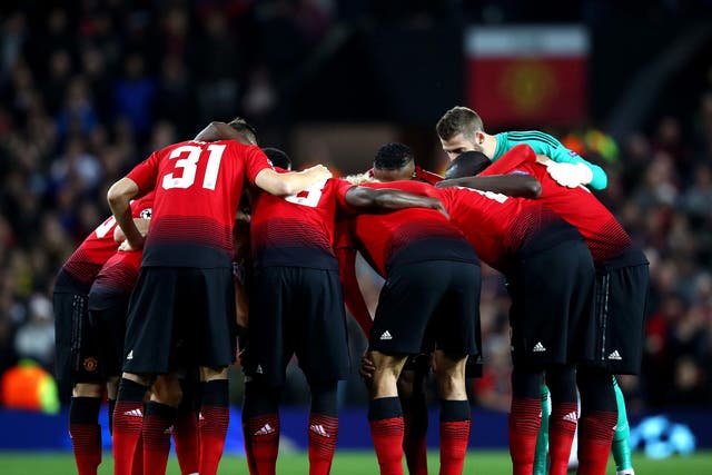 Manchester United's players huddled before kick-off against Valencia