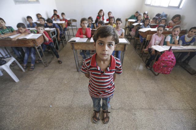 Abdullah, eight, at school in Idlib, Syria 