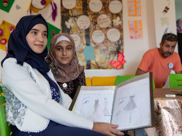 Aya, left, lost out on six years of education after her school in Syria was bombed