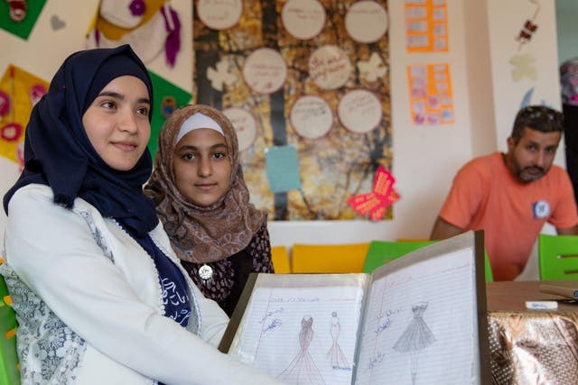 Aya, left, lost out on six years of education after her school in Syria was bombed