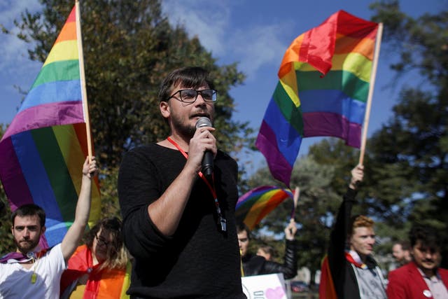Vlad Viski of LGBT+ rights group Mozaiq delivers a speech during a protest against the referendum in Bucharest, Romania