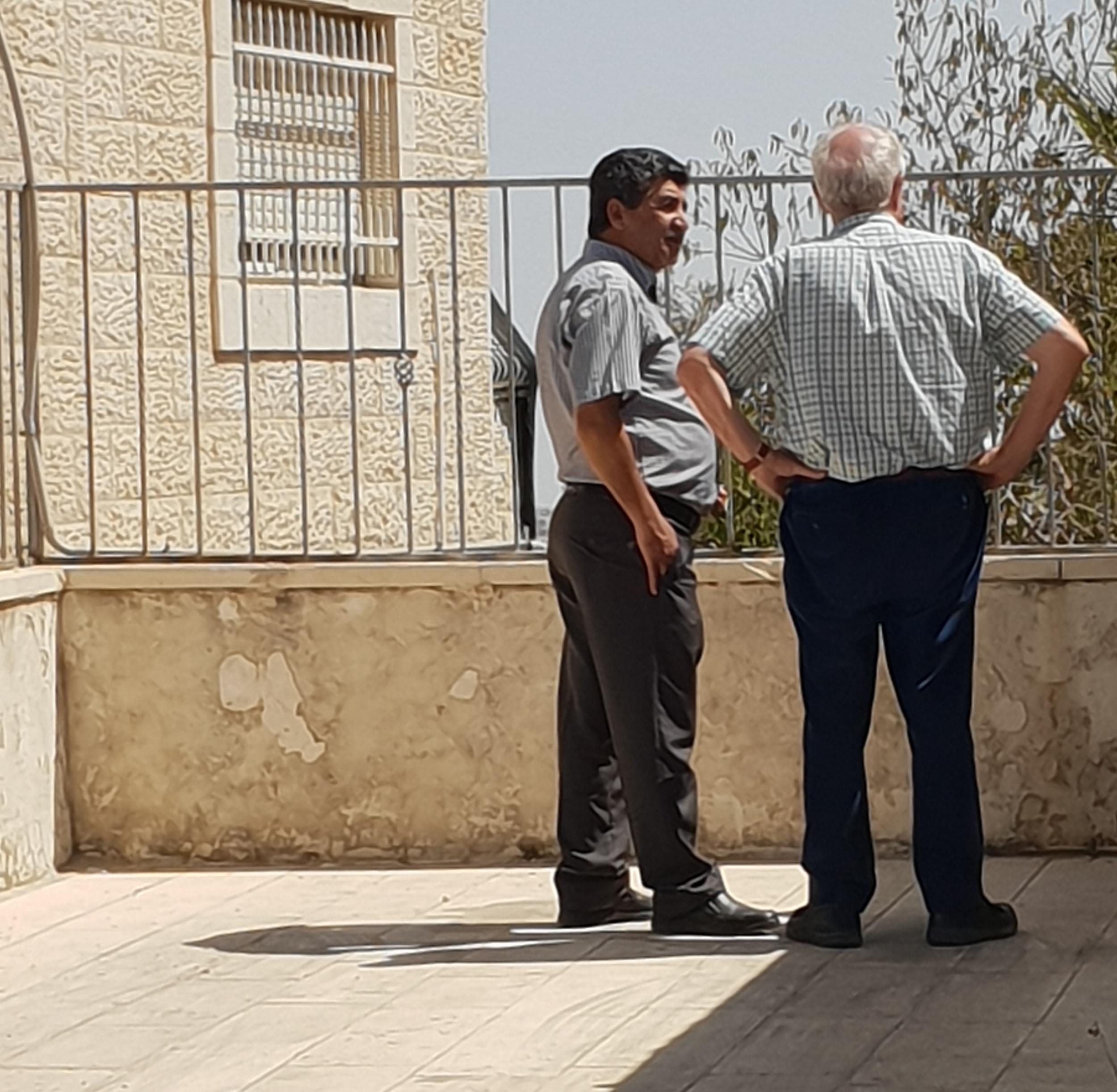 Palestinian Sulieman Khatib stands with The Independent’s Robert Fisk in the Israeli colony of Psgat Zeev, close to the site of the family land taken from them by Israel in 1993